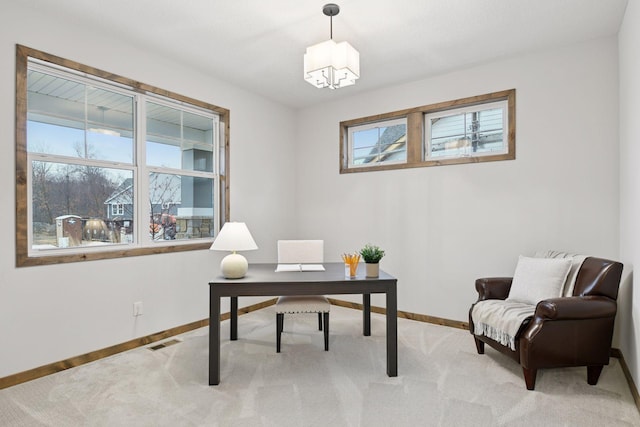 home office featuring carpet, visible vents, baseboards, and an inviting chandelier