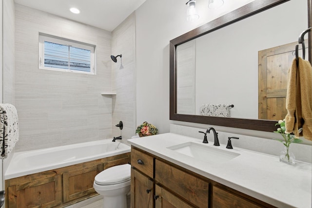 bathroom with toilet, vanity, and shower / bathing tub combination