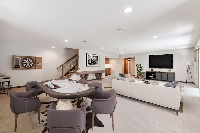 carpeted living room with recessed lighting, stairway, and baseboards