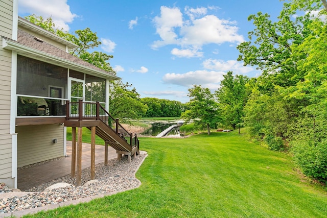 18928 Katrine Ct, Lakeville, MN 55044 - view of green lawn featuring a sunroom, stairs, and a patio