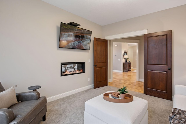 18928 Katrine Ct, Lakeville, MN 55044 - living room with light carpet, a glass covered fireplace, and baseboards