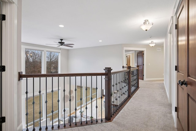18928 Katrine Ct, Lakeville, MN 55044 - hall featuring light carpet, baseboards, recessed lighting, and an upstairs landing