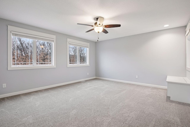 18928 Katrine Ct, Lakeville, MN 55044 - unfurnished room with light colored carpet, ceiling fan, and baseboards