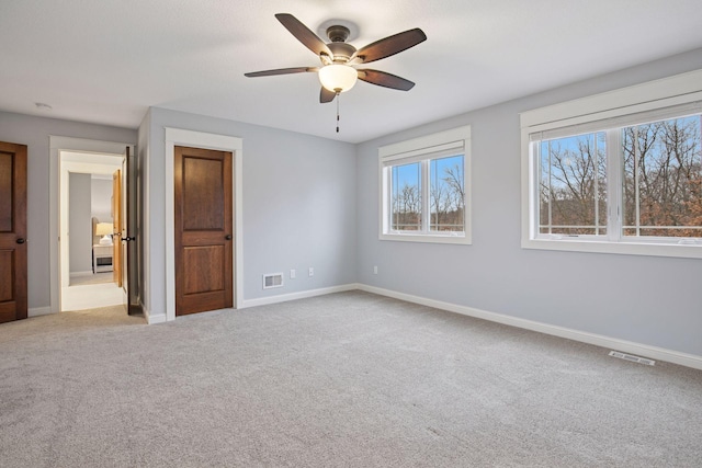 18928 Katrine Ct, Lakeville, MN 55044 - unfurnished bedroom featuring carpet, baseboards, and ceiling fan
