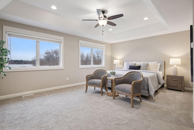 18928 Katrine Ct, Lakeville, MN 55044 - bedroom with light carpet, baseboards, a raised ceiling, recessed lighting, and ceiling fan