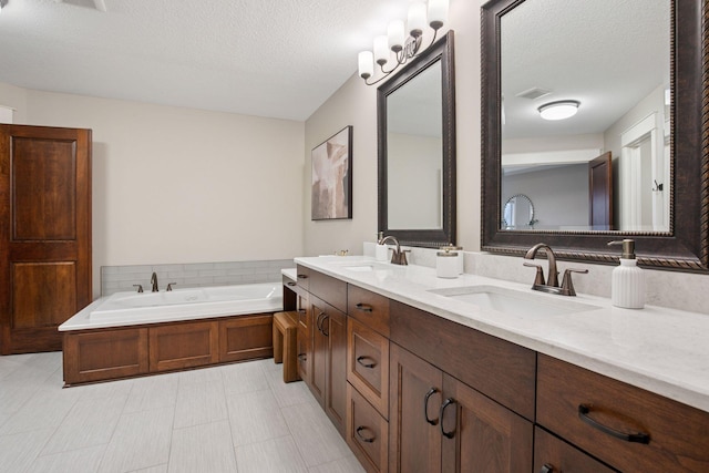 18928 Katrine Ct, Lakeville, MN 55044 - bathroom featuring double vanity, a textured ceiling, and a bath