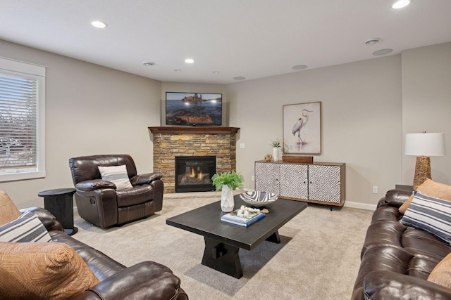 18928 Katrine Ct, Lakeville, MN 55044 - carpeted living area with recessed lighting, a stone fireplace, and baseboards