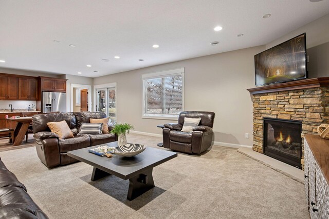 18928 Katrine Ct, Lakeville, MN 55044 - living room with light carpet, a fireplace, recessed lighting, and baseboards