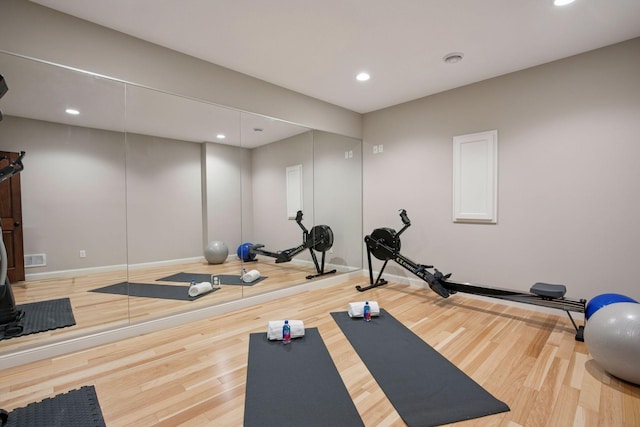 18928 Katrine Ct, Lakeville, MN 55044 - workout area with wood finished floors, baseboards, and recessed lighting