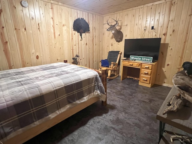 bedroom with wood walls