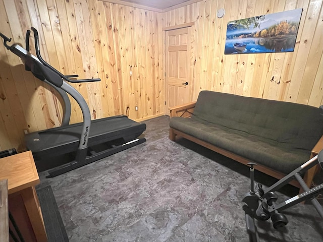 workout room featuring wooden walls