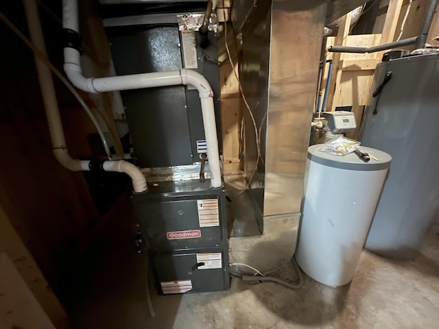 utility room featuring water heater