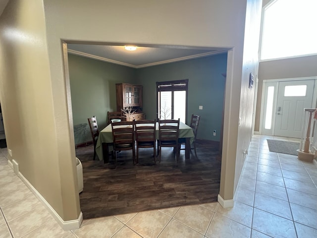 11999 Lake Maud Trl, Lake Eunice Twp, MN 56511 - dining area with baseboards, ornamental molding, light tile patterned floors, and a high ceiling