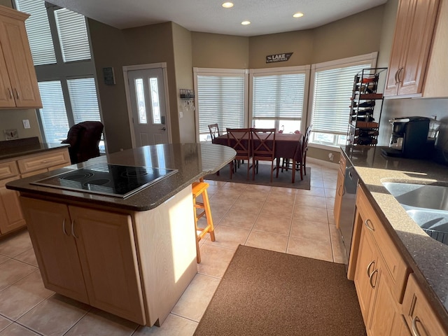11999 Lake Maud Trl, Lake Eunice Twp, MN 56511 - kitchen featuring a kitchen island, light tile patterned flooring, recessed lighting, black electric cooktop, and dark stone countertops