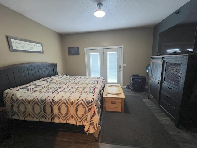 11999 Lake Maud Trl, Lake Eunice Twp, MN 56511 - bedroom with french doors and a wood stove