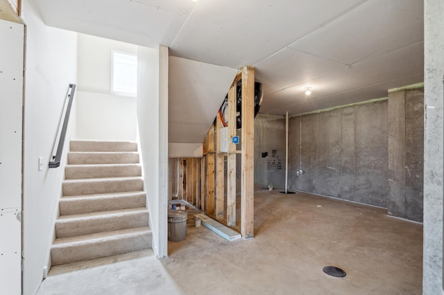 unfinished basement with stairway