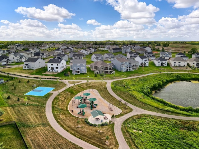 bird's eye view with a water view and a residential view