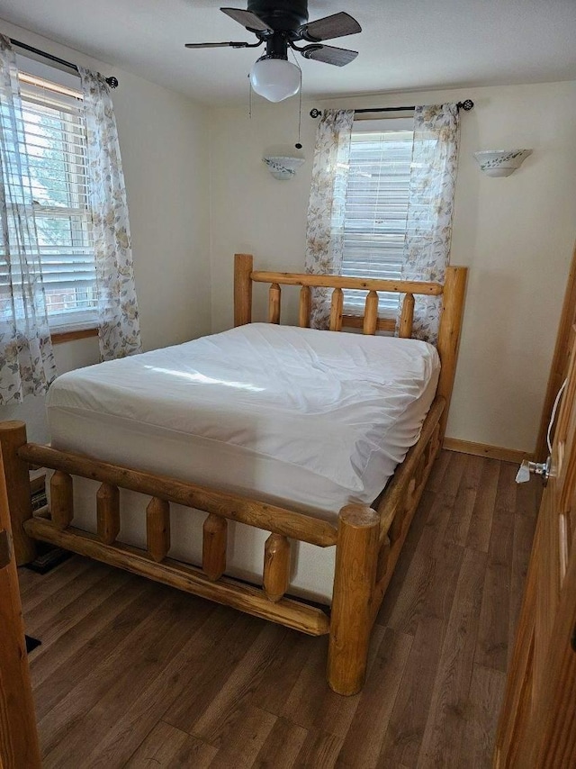 bedroom with baseboards, a ceiling fan, and wood finished floors