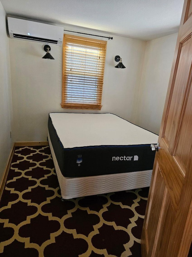 bedroom with a wall mounted AC