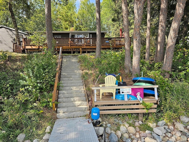 back of house with a wooden deck