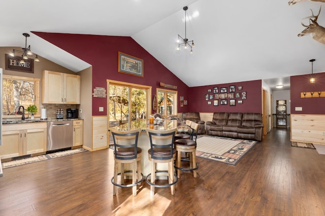 interior space with high vaulted ceiling and dark wood finished floors