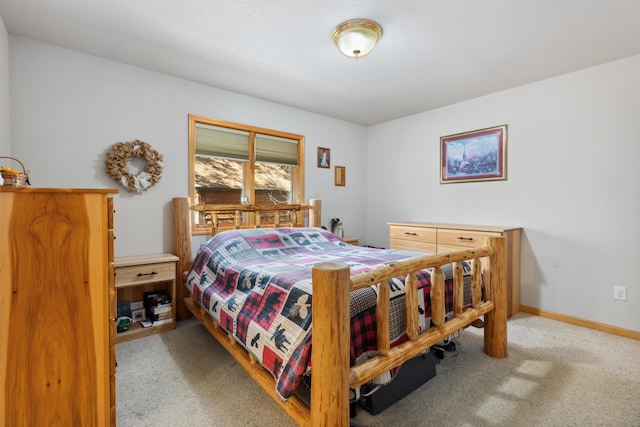 bedroom with carpet and baseboards