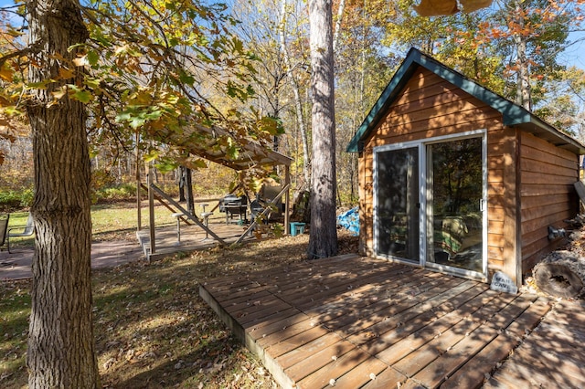 deck featuring an outdoor structure