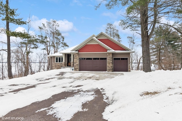 view of front of property featuring stone siding and an attached garage