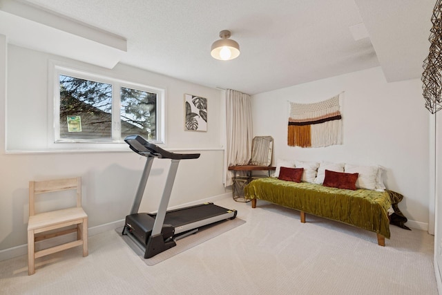 workout area with carpet floors and baseboards