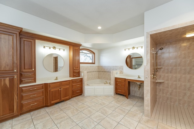 bathroom with tiled shower, two vanities, a bath, and tile patterned flooring