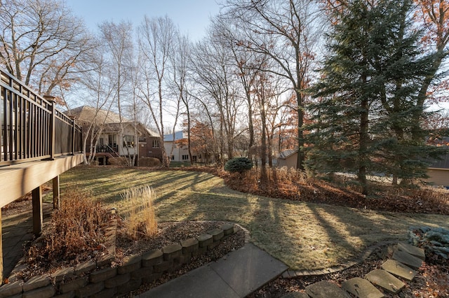 view of yard with a wooden deck