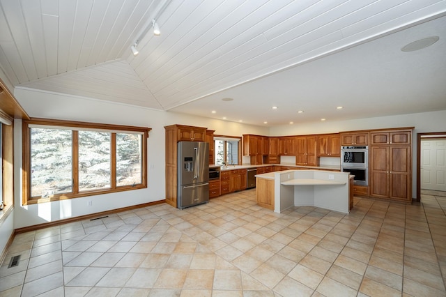 kitchen featuring light countertops, plenty of natural light, visible vents, and stainless steel appliances