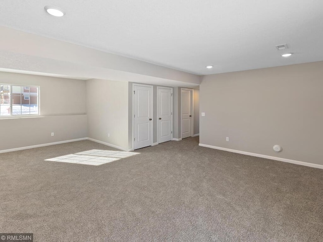 unfurnished bedroom with carpet floors, recessed lighting, visible vents, and baseboards