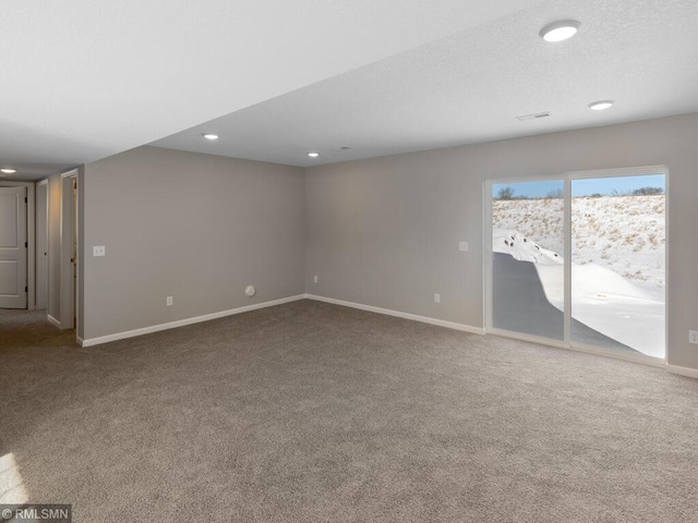 unfurnished room with carpet floors, baseboards, and recessed lighting