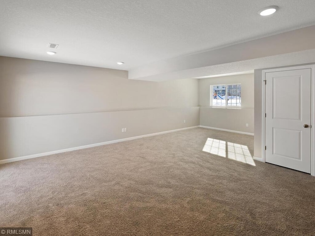 interior space with carpet flooring, visible vents, and baseboards