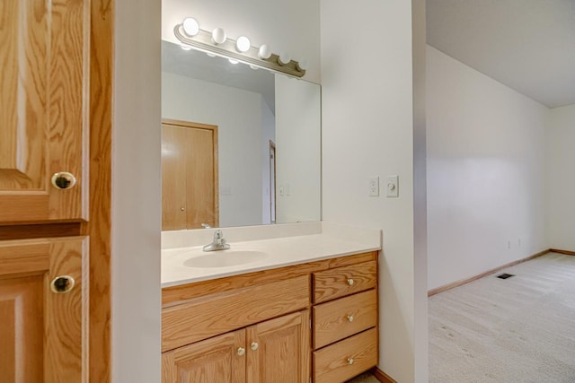 bathroom with visible vents, baseboards, and vanity