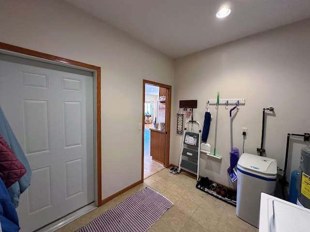 exercise room featuring baseboards and recessed lighting