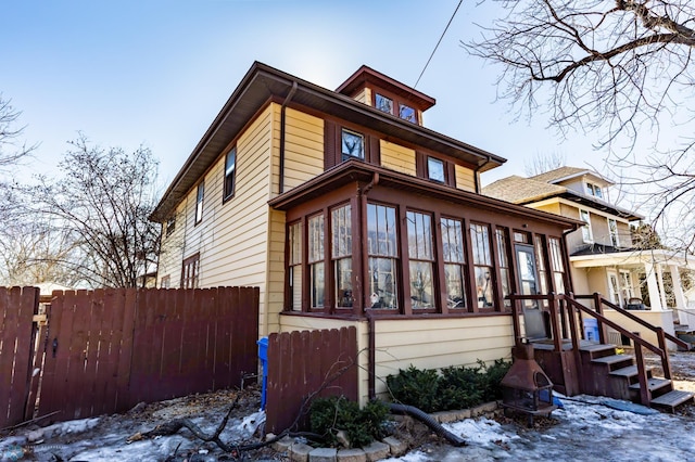 view of front of house featuring fence