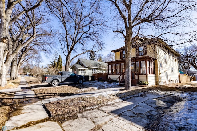 view of home's exterior featuring a sunroom