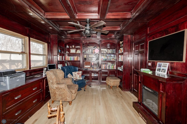 living area with wooden walls, coffered ceiling, and wood finished floors