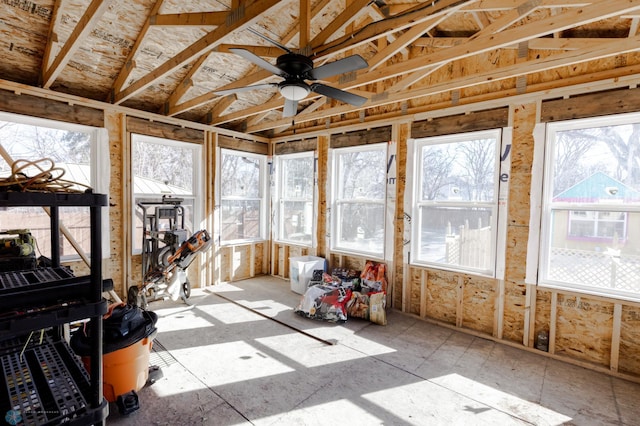 unfurnished sunroom featuring a ceiling fan