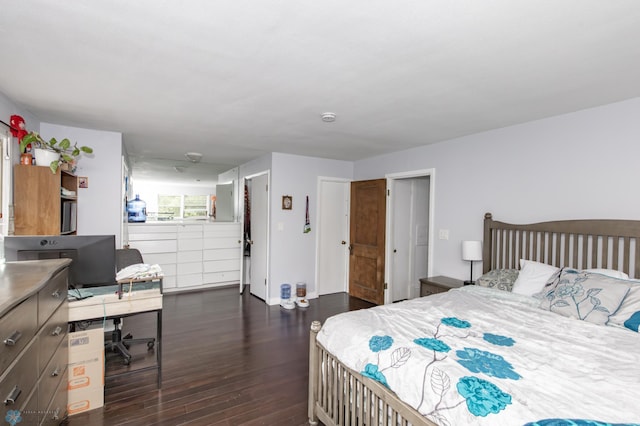 bedroom with dark wood-style floors