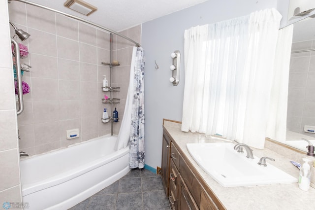 full bathroom featuring shower / tub combo, vanity, visible vents, and tile patterned floors