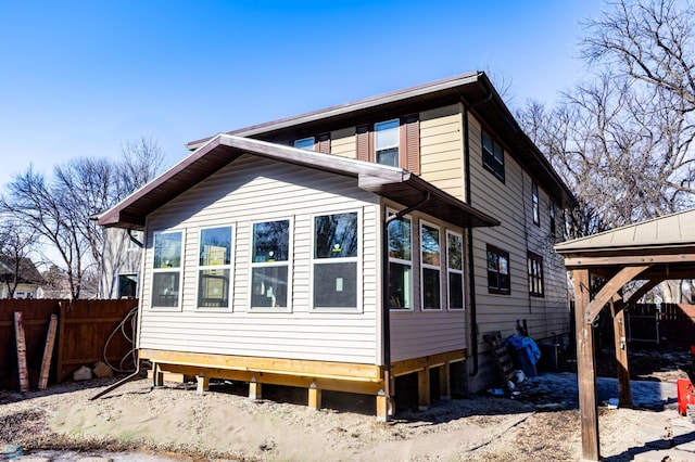 rear view of property with fence