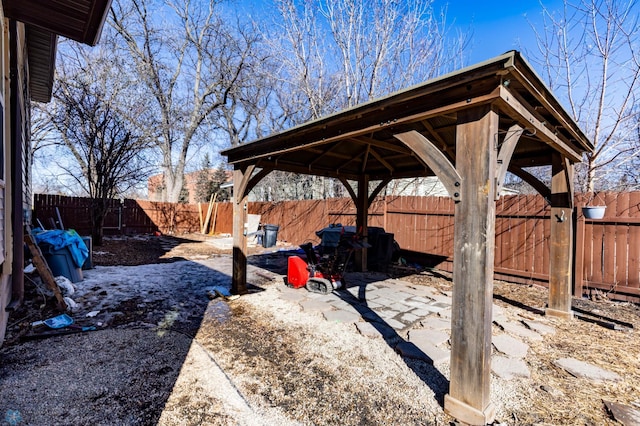 view of yard featuring a patio area, a fenced backyard, and a gazebo