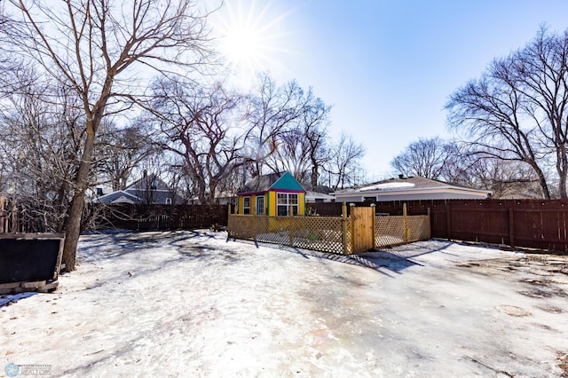 exterior space featuring a fenced front yard and a gate