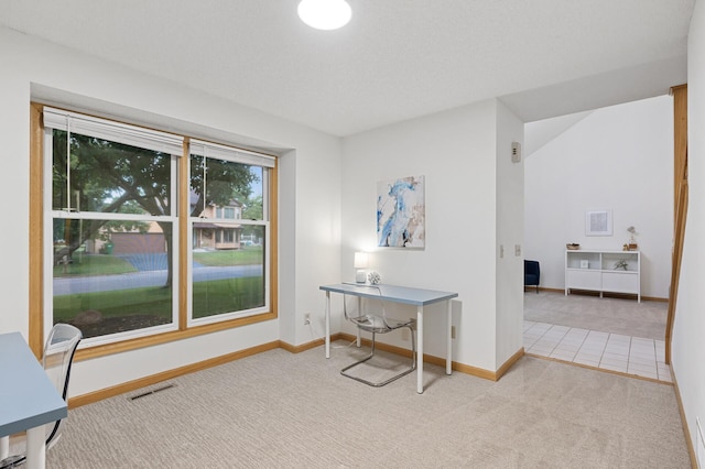 carpeted home office with visible vents and baseboards