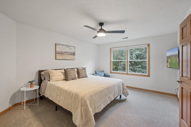 bedroom with ceiling fan, carpet, visible vents, and baseboards