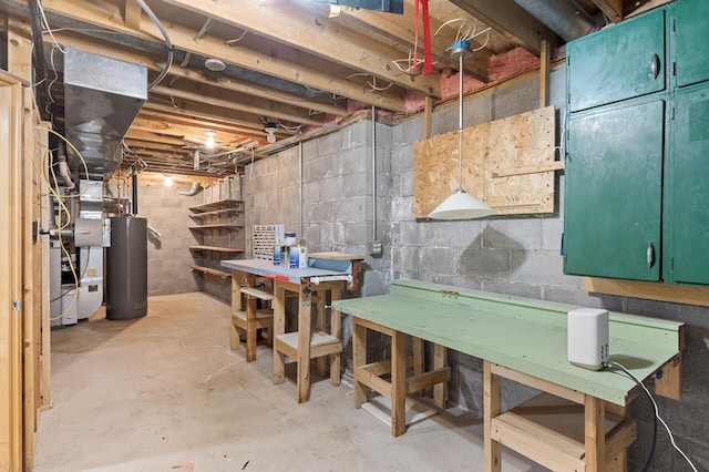 unfinished basement with water heater and a workshop area