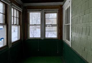 unfurnished sunroom featuring a healthy amount of sunlight